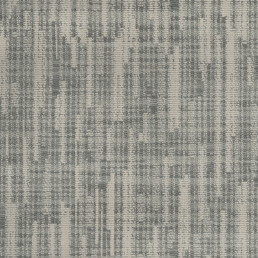 Blurred Lines On Trend Carpet features a photography-inspired woven pattern with vertical and horizontal gray lines on a light gray base. This modern, subtly distressed carpet is crafted from durable EnVision Nylon.