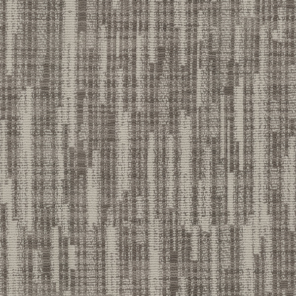 A close-up of Blurred Lines On Trend Carpet shows a textured woven pattern with vertical and horizontal stripes in beige, taupe, and brown, creating an abstract, modern design inspired by photography.