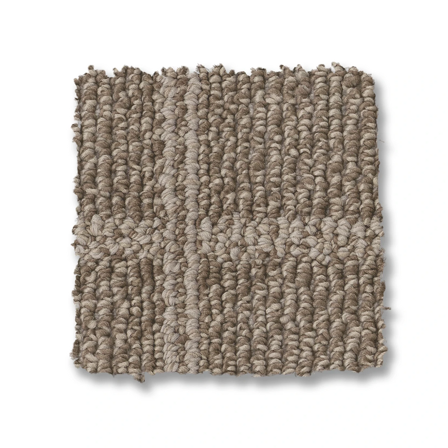 A square sample of Breeze Block Berber Carpet features textured, looped fibers in beige and taupe tones with a subtle cross windowpane pattern in a lighter shade.