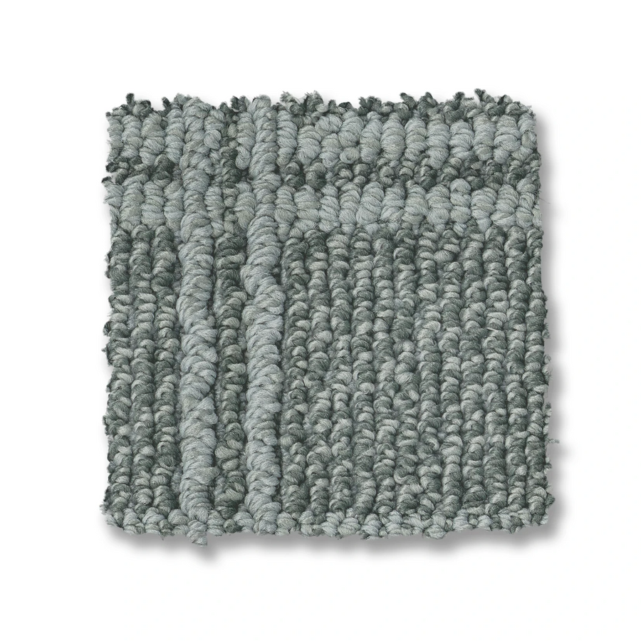 A square swatch of Breeze Block Berber Carpet featuring textured gray loops and a subtle windowpane pattern on a white background.
