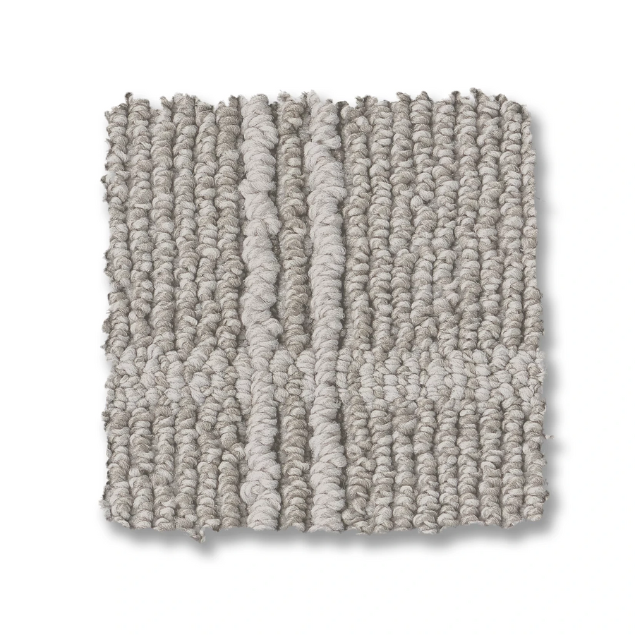 A square swatch of Breeze Block Berber Carpet in light gray features a looped texture and a subtle geometric windowpane pattern of vertical and horizontal lines. The slightly uneven edges are set against a white background.