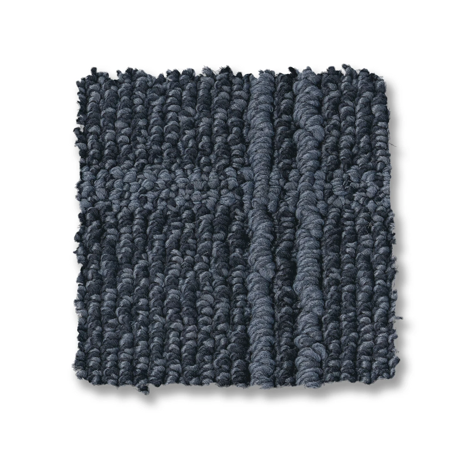 A square swatch of Breeze Block Berber Carpet in dark blue, featuring a textured windowpane pattern and looped design, is displayed on a white background.