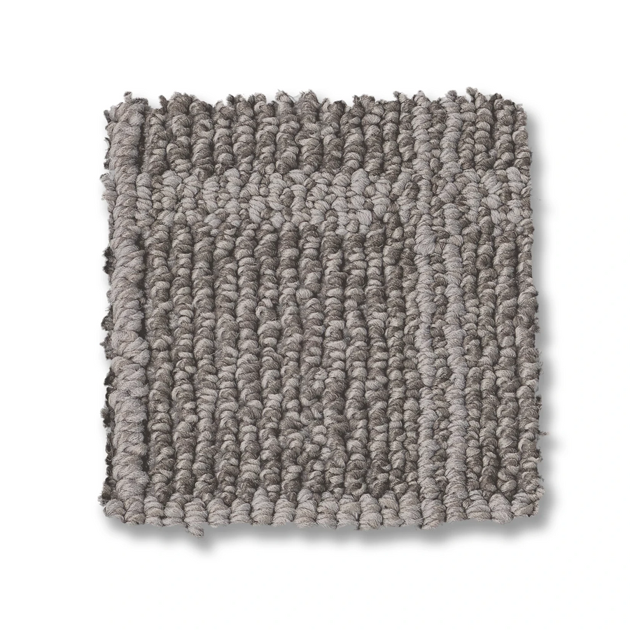 A square sample of Breeze Block Berber Carpet in gray loop pile, featuring a subtle textured windowpane pattern, tightly woven and shown on a white background.