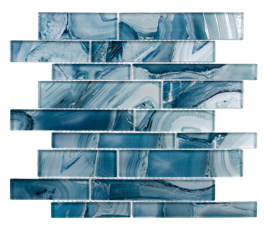 The Magical Forest Random Brick Mosaic Glass Tile features rectangular glass tiles in blue and white, arranged in a staggered brick pattern with marble-like swirls and veining on each tile.