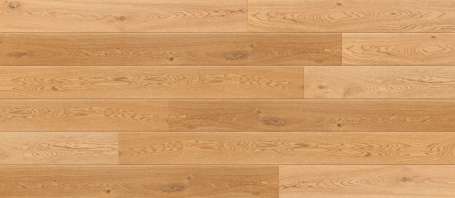 Ellington European Oak 8 5/8" Hardwood features light brown, wide planks with natural wood grain and varying tan and caramel tones. The smooth, even finish offers a clean, elegant look to any space.
