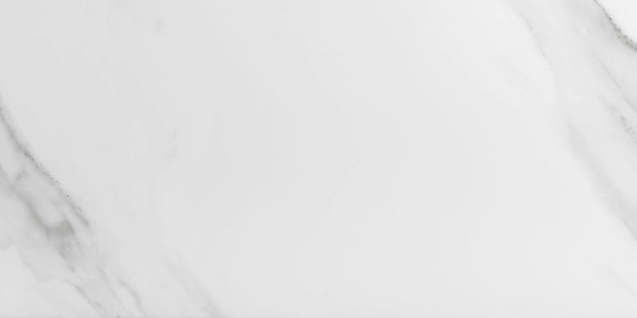 Buckingham Palace 12x24 Porcelain Tile features a white marble look with subtle grey veining that flows diagonally across its matte surface, creating a smooth and modern minimalistic background.