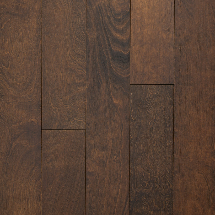 A close-up of Canyon Creek Birch 6.5" Hardwood highlights the textured beauty and character of wire-brushed engineered wood flooring.