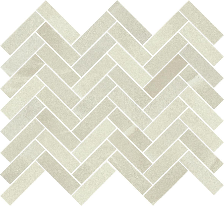 Royal Marbles II 1x3 Herringbone tiles in light beige porcelain create a zigzag herringbone pattern with visible, slightly lighter grout lines between the rectangular tiles.