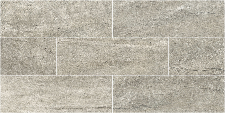 Santorini 4x12 Porcelain Tile features a grey stone-effect with subtle natural surfaces and fine veining, arranged in a staggered brick pattern for a tactile, elegant look that authentically mimics real stone.
