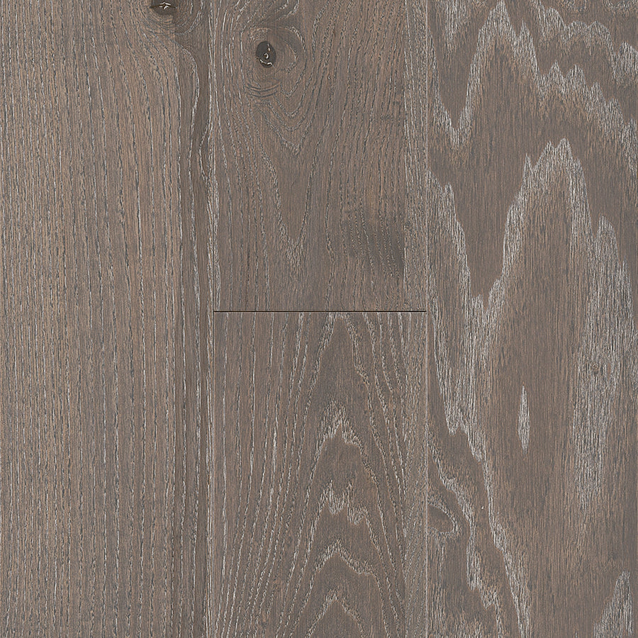 Close-up of Urban Forest 6.5" Ash Hardwood flooring, showcasing visible grain, natural knots, and a matte finish that highlights its textured and rustic look.