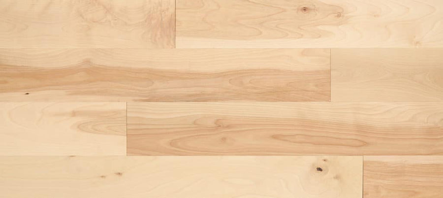 Charm City 5" Yellow Birch Hardwood features light-colored, smooth-finished floorboards with natural grain and subtle color variations. Durable and timeless, this hardwood flooring showcases classic knots for an elegant look.