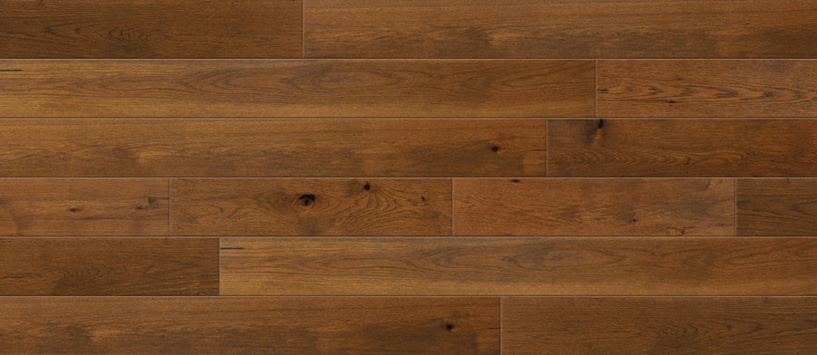Entourage 7 1/2" Hickory Hardwood features a smooth, medium-brown finish with natural grain and knots. Boards are installed horizontally in a staggered pattern—perfect for high-traffic areas needing style and durability.