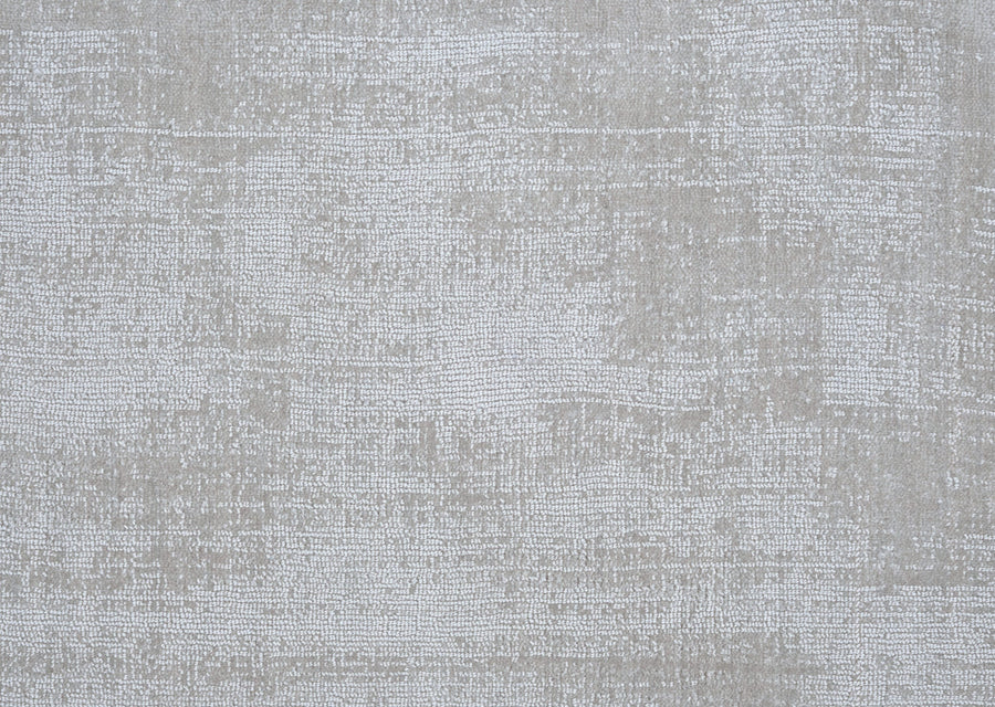 Prague On Trend Carpet features a textured light gray surface with a subtle, irregular pattern that mimics woven fabric, inspired by modern palettes for a neutral, slightly distressed look.