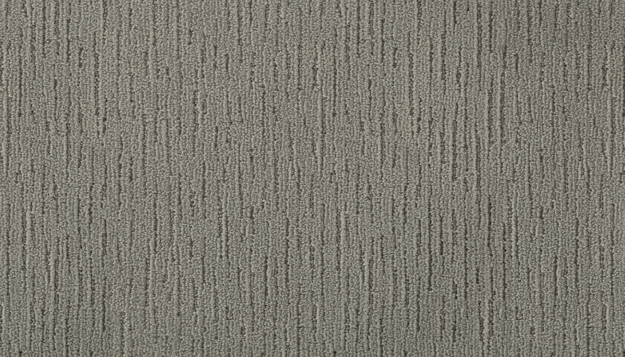 Close-up of the Clever Sensation Family Friendly Carpet in gray, showcasing a durable textured surface with a subtle linear pattern of vertical dark and light lines for a modern, understated look.