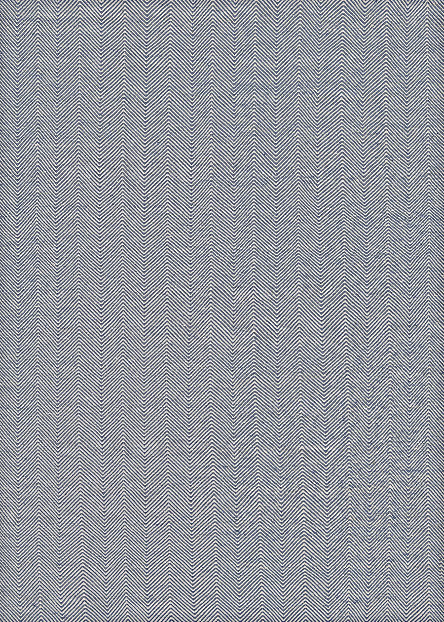 The Cottages Bungalow Indoor/Outdoor Area Rug features a black and white vertical chevron pattern with wavy zigzag lines, creating an optical illusion of movement—perfect for mold and mildew resistant outdoor spaces.