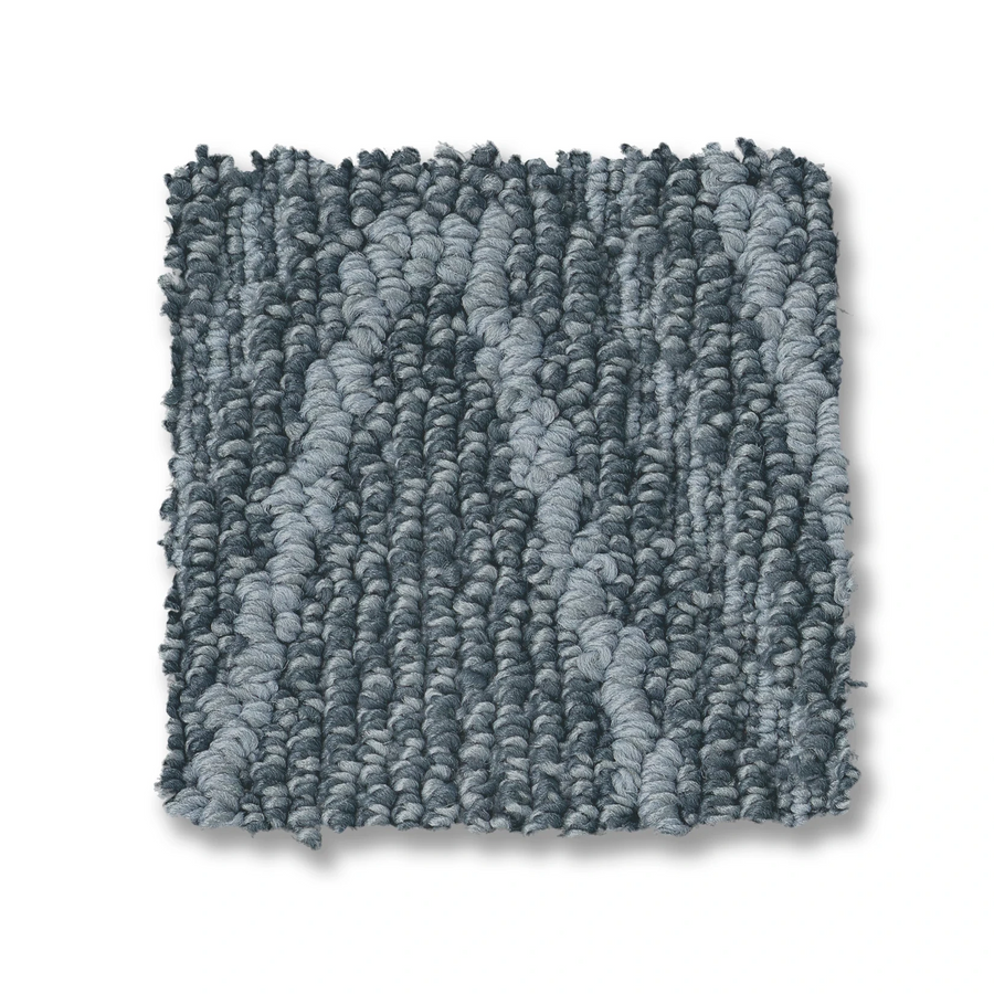 A square swatch of Cozy Cable Berber Carpet in blue-gray, with a subtle linear and wavy looped cable pattern for high-traffic areas, is shown on a white background.
