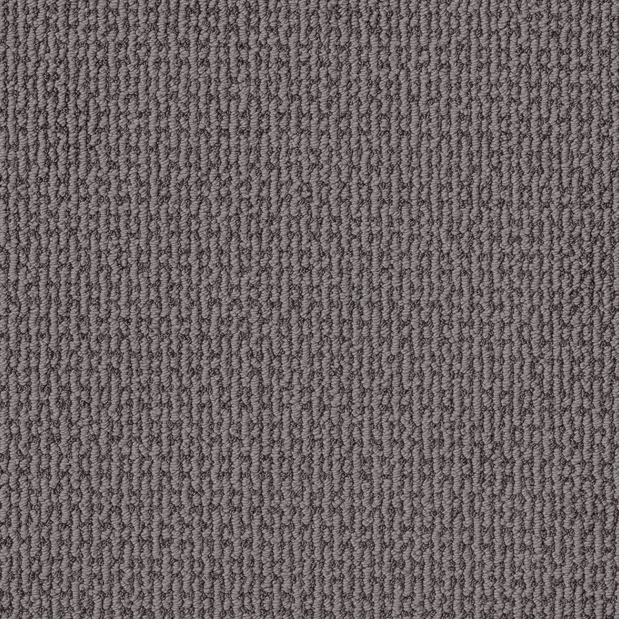 Close-up of Crafted Embrace Family Friendly Carpet, featuring textured, looped gray fibers with vertical ridges. Made from high-performance material, it’s soft, dense, and perfect for flooring or rugs.