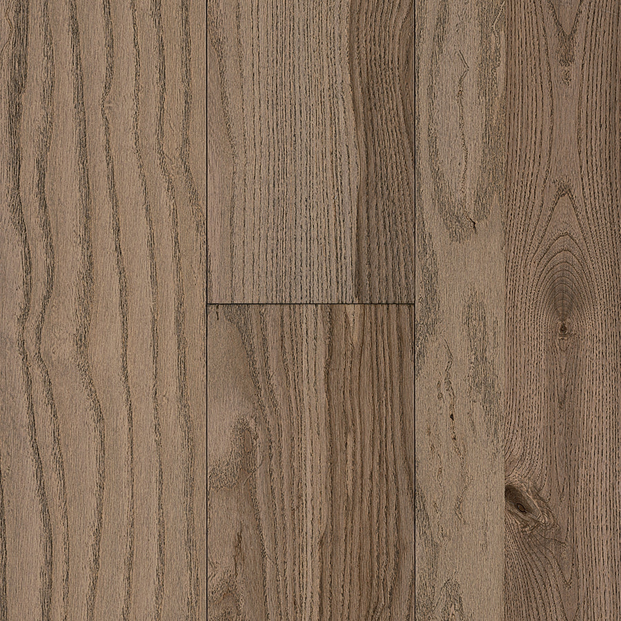Urban Forest 6.5" Ash Hardwood planks in medium brown feature a matte finish, natural wood grain patterns, subtle color variations, and enhanced scratch resistance, arranged vertically.