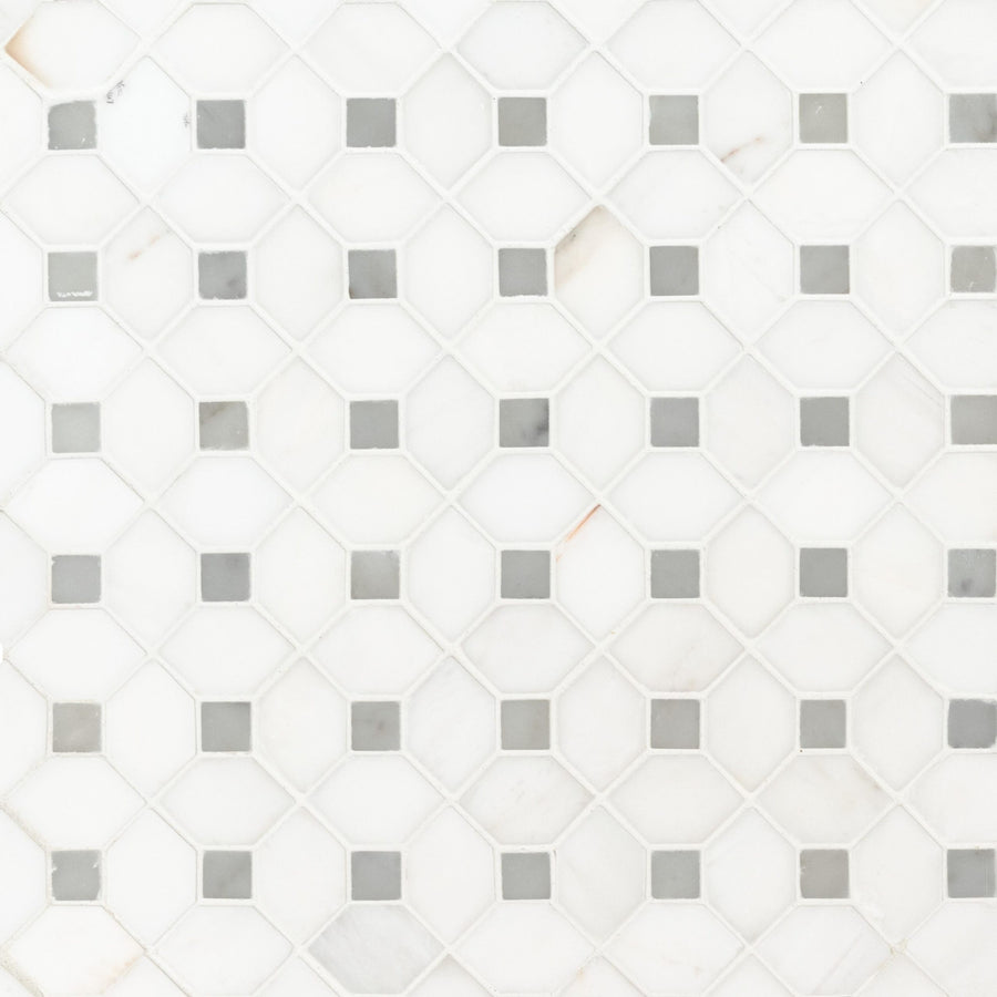 The Dolomite Dotty Mosaic Natural Stone tile features white octagonal pieces with small gray corner squares, forming a repeating geometric pattern and providing a clean, minimalistic look.
