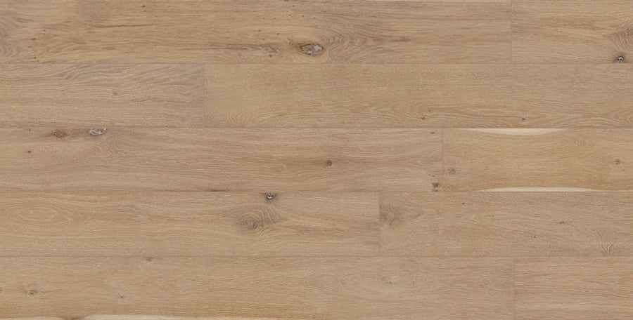 Dorchester White Oak 6 1/2" hardwood features light brown engineered planks with distinct wood grain and knots; wide boards are laid horizontally, adding a natural and warm texture to any space.