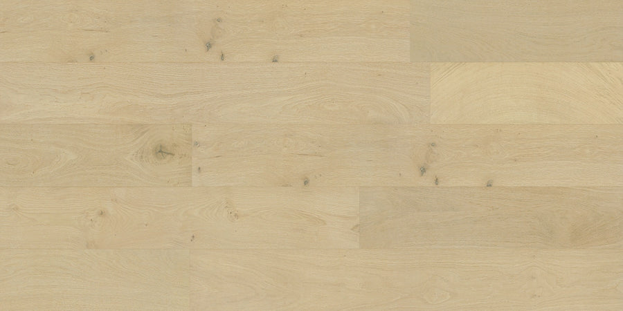 Dorchester White Oak 6 1/2" Hardwood features light-colored engineered planks with natural grain patterns and subtle knots, offering a smooth, clean look in a wide-width design.
