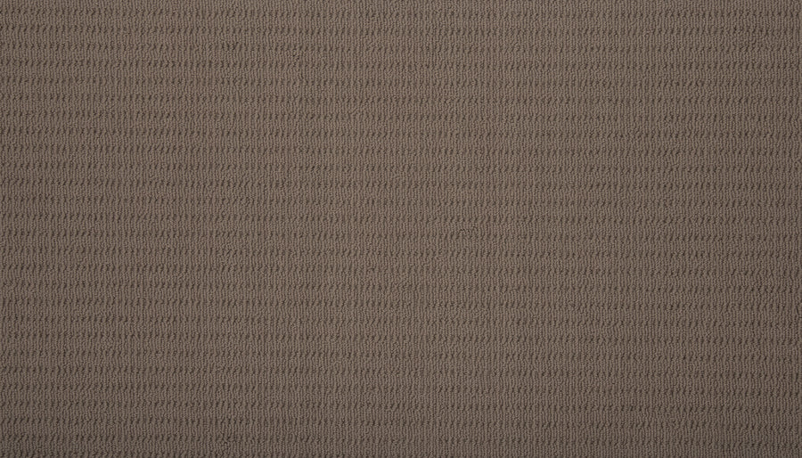 A close-up of Eloquent Vision Family Friendly Carpet in brown, showcasing its subtle, evenly spaced horizontal ribbed texture for added depth and elegance to luxury flooring.