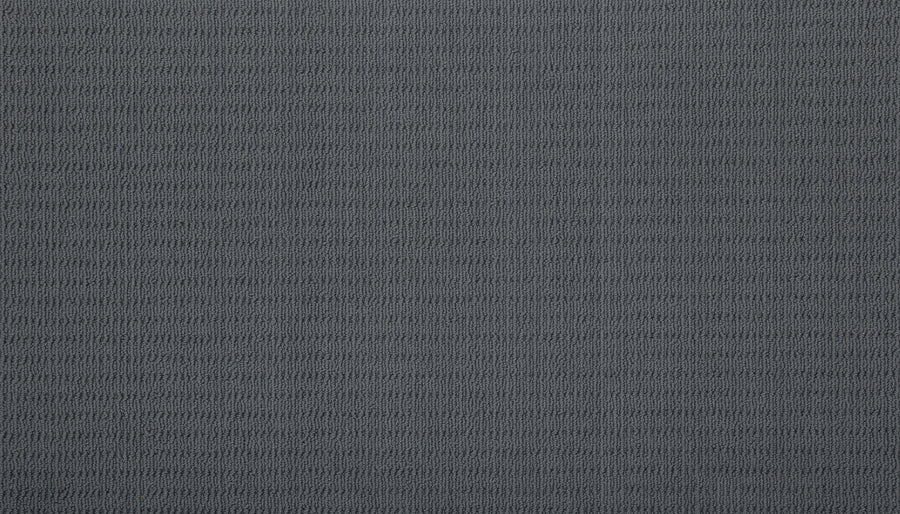 Close-up of Eloquent Vision Family Friendly Carpet featuring a textured dark gray cut and loop design with a subtle horizontal ribbed pattern—perfect for luxury flooring.