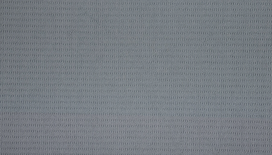 Eloquent Vision Family Friendly Carpet features a light blue textured surface with a subtle horizontal ribbed pattern in evenly spaced rows, offering a soft, slightly raised look—an elegant option for luxury flooring.