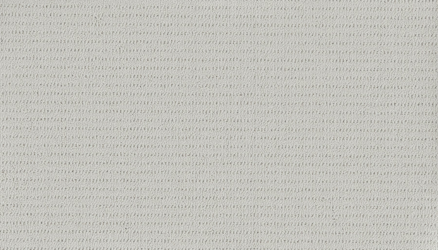 Close-up of Eloquent Vision Family Friendly Carpet in light gray, featuring a soft, uniform surface with subtle horizontal ribs—perfect for those seeking luxury flooring or elegant cut and loop carpet designs.