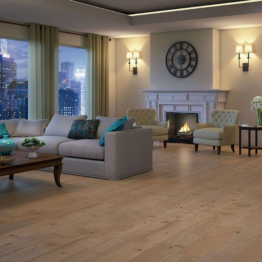 A modern living room features Prime Exotic 1/2" x 5 1/4" Hardwood flooring, a gray sofa, two beige armchairs, wooden coffee table, cozy fireplace, wall clock, sconces, green curtains, and city views from large windows.
