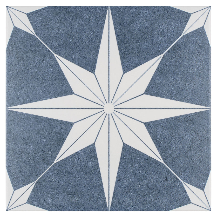 The Stella 9 3/4 x 9 3/4 Patterned Tile features a blue and white geometric design and is frost resistant, making it ideal for adding style to both indoor and outdoor spaces.