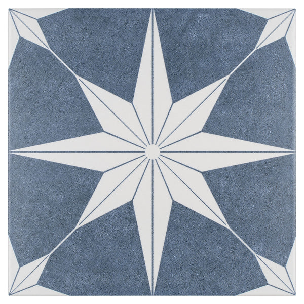 The Stella 9 3/4 x 9 3/4 Patterned Tile features a blue and white geometric design and is frost resistant, making it ideal for adding style to both indoor and outdoor spaces.