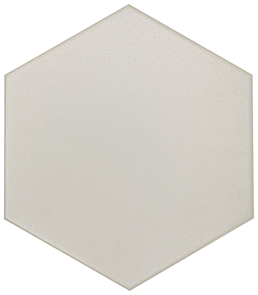 The Watercolor 8x9 Hexagon Matte Ceramic Tile features a smooth, light beige matte surface and geometric design, viewed from above—ideal for adding subtle style to any watercolor-inspired collection or interior project.