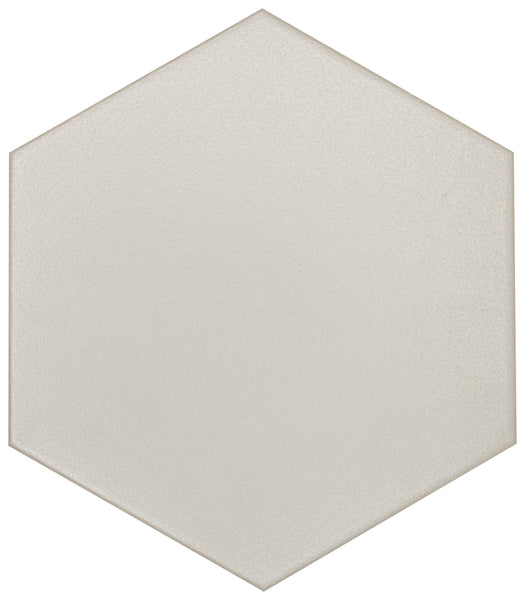 The Watercolor 8x9 Hexagon Matte Ceramic Tile features a smooth, light beige matte surface and geometric design, viewed from above—ideal for adding subtle style to any watercolor-inspired collection or interior project.