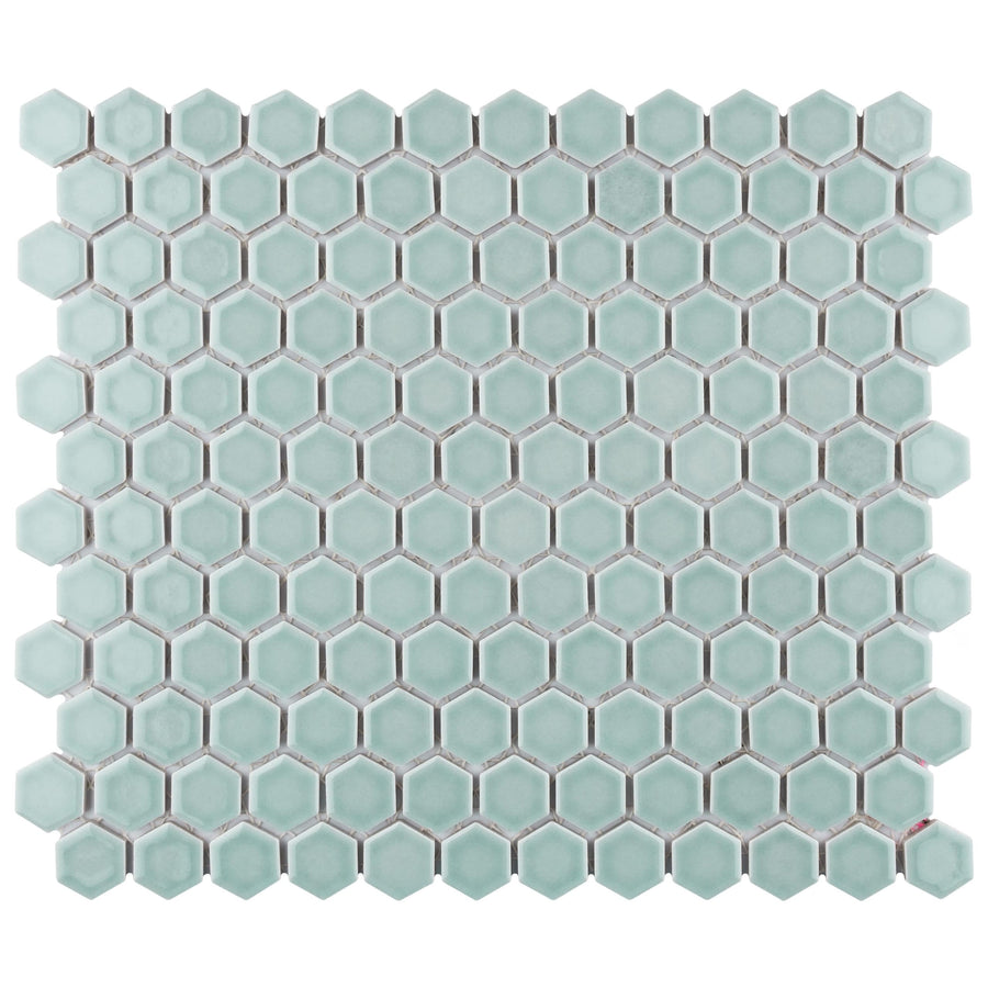 A sheet of Tribeca 1" Hex Glossy Mosaic Tile in light green, arranged in a honeycomb pattern with white grout—ideal for adding a stylish accent to floors and walls.