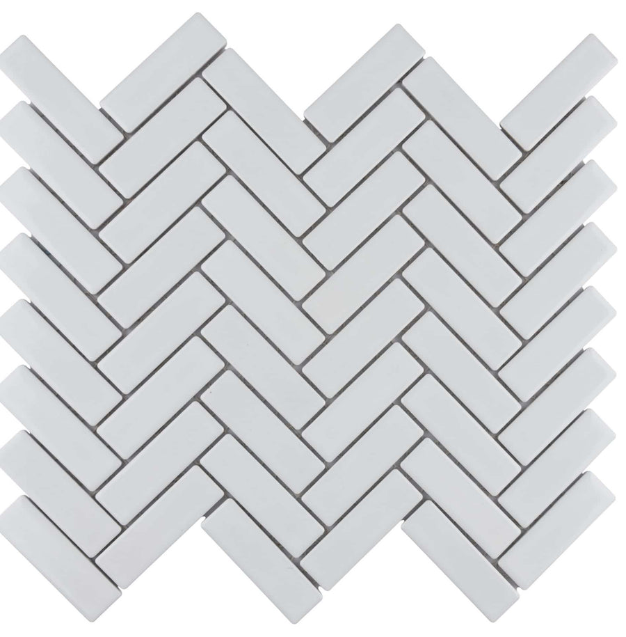Metro Brick Herringbone Mosaic Tile features rectangular white porcelain pieces in a herringbone pattern, creating a stylish zigzag, interlocking design on a white background.