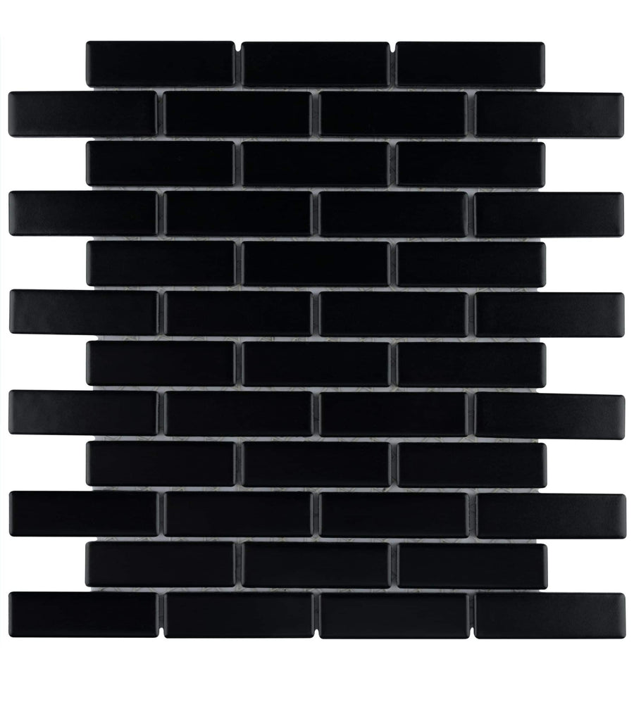 The Metro Brick Offset Mosaic Tile features rectangular black tiles in a staggered brick pattern with white grout, ideal as a backsplash for modern kitchens or bathrooms.