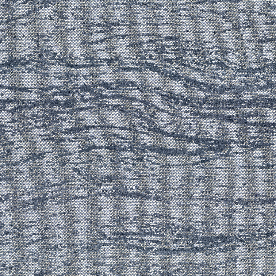 A close-up of FREEstyle On Trend Carpet showcases an abstract, wavy pattern in blue and gray, crafted with TECHnique tufting for a calming, water-inspired look reminiscent of marble or flowing water.