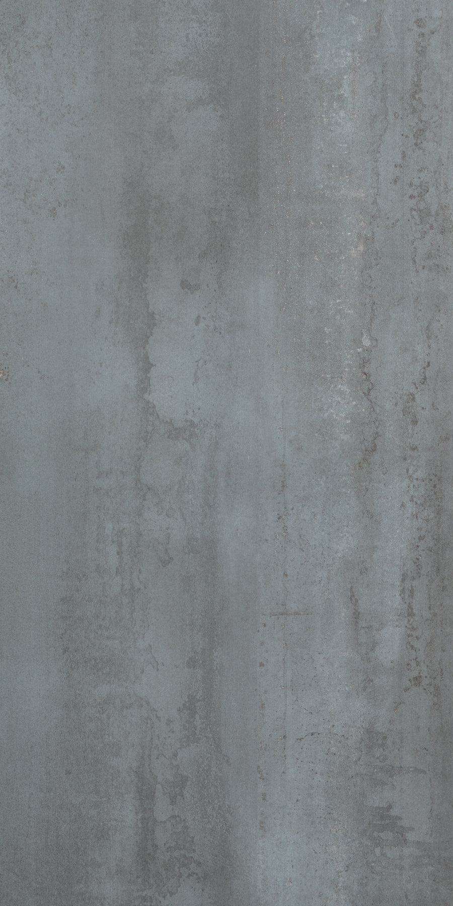 The Platform 24x48 Porcelain Tile features a textured gray concrete look with varied shades and irregular patterns, offering an industrial, slightly weathered appearance inspired by metal cladding.