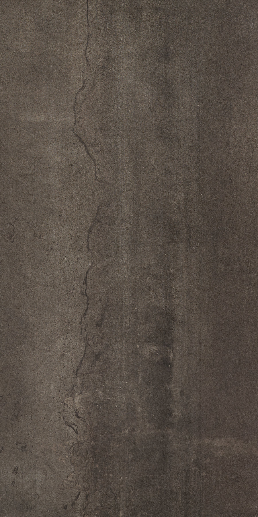 A close-up of Platform 12x24 Porcelain Tile shows its dark, textured concrete look with a prominent vertical crack, metallic accents, and a rough, weathered surface for contemporary style.