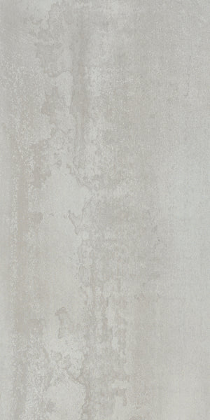 A close-up of a wall featuring Platform 12x24 Porcelain Tile, highlighting its rich color palette and intricate textures reminiscent of aged metal plates.