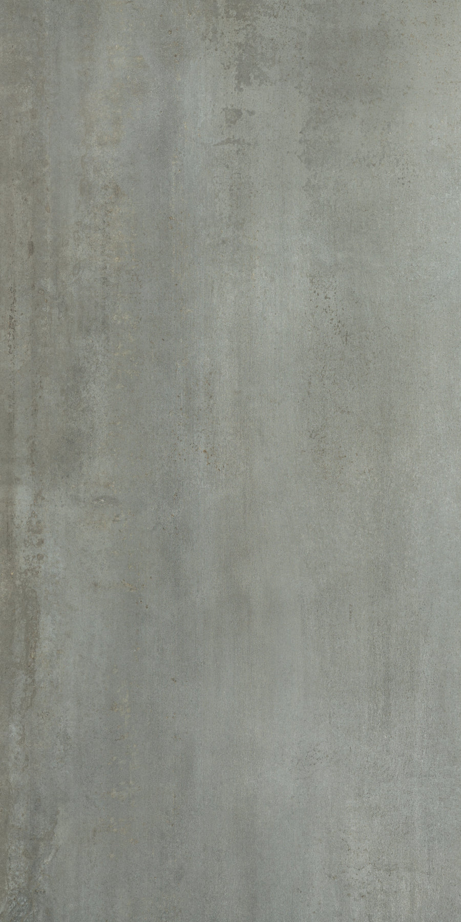 The Platform 24x48 Porcelain Tile features a textured gray concrete look with subtle tonal variations and faint streaks, creating a slightly weathered, industrial style reminiscent of metal cladding.