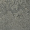 A close-up of Platform 2x8 Porcelain Tile shows its rough, gray surface with an uneven, metallic texture and subtle shading variations.
