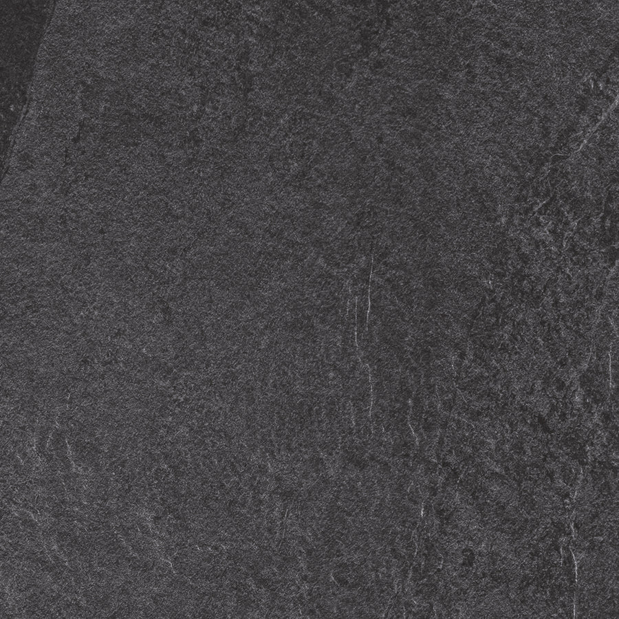 The Slide 24x24 Porcelain Tile features a dark gray, textured stone look with subtle shading and fine veining, offering a modern, organic style ideal for contemporary interiors.