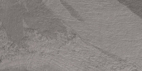 A close-up of the Slide 12x24 Porcelain Tile showcases its textured gray surface with natural lines, ridges, and layered patterns—ideal for modern slate-inspired and contemporary design applications.
