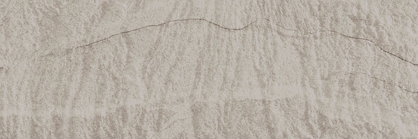 Close-up view of Slide 4x12 Porcelain Tile in light beige, showcasing textured surface with visible cracks and uneven horizontal lines for a natural, weathered look ideal for contemporary spaces.