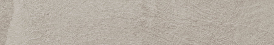 Slide 8x48 Porcelain Tile features a light beige surface with subtle, wavy textures and natural variations, resembling smooth, weathered rock. Its soft, organic pattern suits contemporary spaces and adds gentle movement to your design.