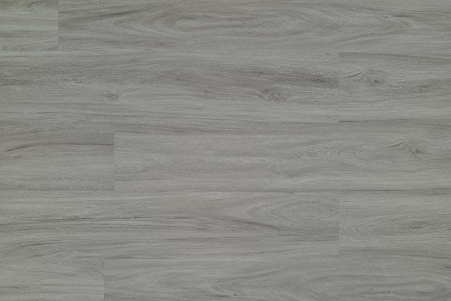 Hydro Vinyl II 7" Vinyl Plank offers gray wood-look flooring with a matte finish, natural grain patterns, and knots in varying gray shades. This durable, waterproof SPC plank delivers lasting style with horizontal wood-like appeal.