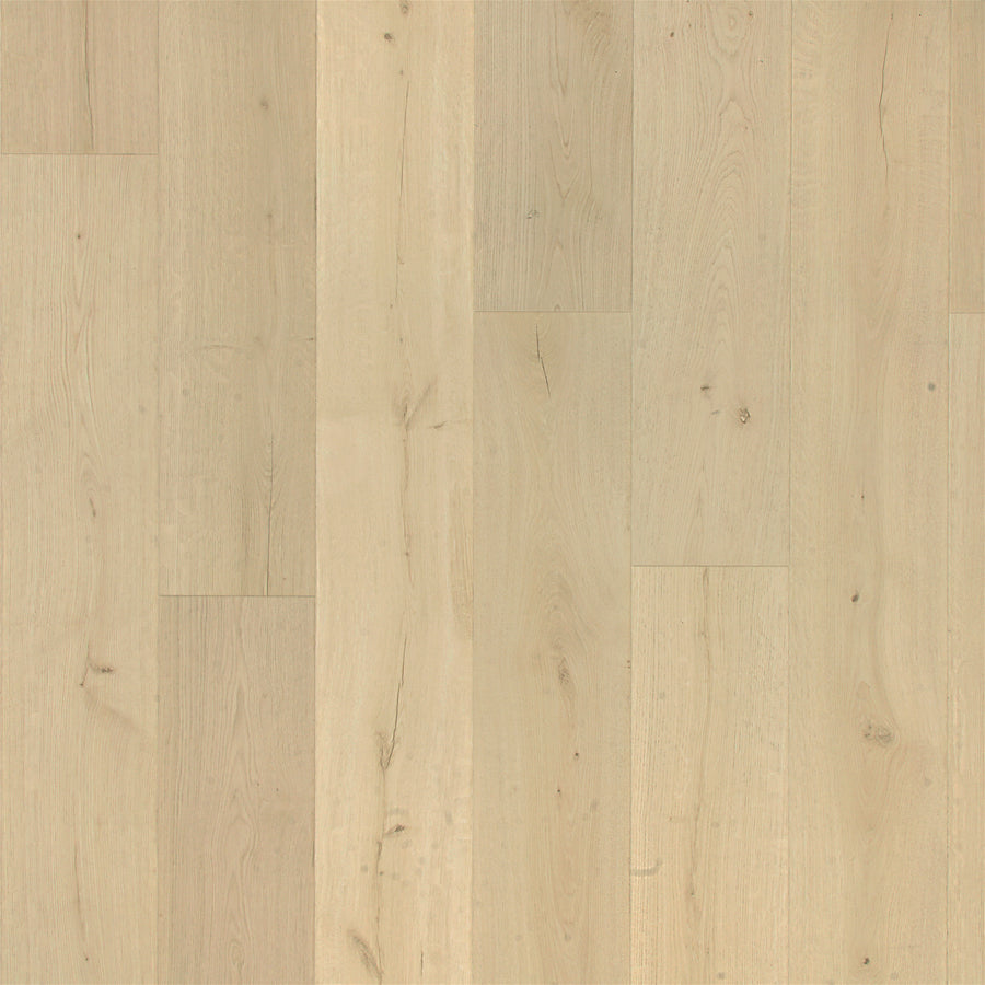 High Spirits 9 7/16" Waterproof Laminate flooring features light wood tones, a smooth natural finish, subtle grain and knots for authenticity, and a scratch-resistant surface that keeps the vertically aligned planks clean and pristine.