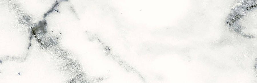 The Glam 4x12 Glossy Porcelain Tile features a white marble look with subtle gray and black veining, offering a smooth, elegant texture—ideal for sophisticated wall or floor tile installations.